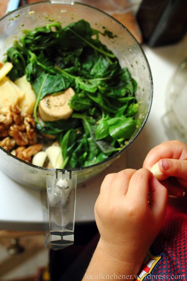 peeling garlic for pesto