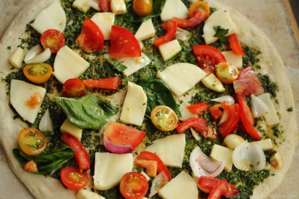 Tomato Pesto Pizza ready to be baked